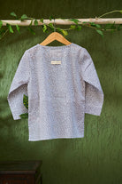 girl-dressed-in-unisex-kids-grey-kurta-for-boys-and-girls-handblock-printed-in-Jaipur-made-with-soft-and-breathable-cotton