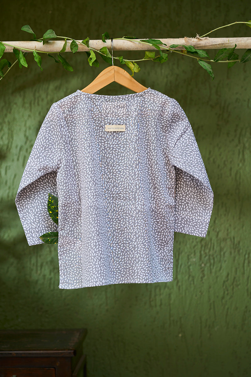 girl-dressed-in-unisex-kids-grey-kurta-for-boys-and-girls-handblock-printed-in-Jaipur-made-with-soft-and-breathable-cotton