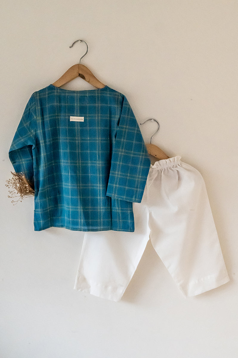 Kids unisex Kurta Pajama set wiith Navy Blue Checks Kurta and White Pajamas perfect for summers. Kurta made with soft breathable handwoven cotton and pajamas made in GOTS certified organic cotton. 