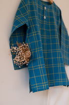 Kids unisex Kurta Pajama set wiith Navy Blue Checks Kurta and White Pajamas perfect for summers. Kurta made with soft breathable handwoven cotton and pajamas made in GOTS certified organic cotton. 
