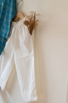 Kids unisex Kurta Pajama set wiith Navy Blue Checks Kurta and White Pajamas perfect for summers. Kurta made with soft breathable handwoven cotton and pajamas made in GOTS certified organic cotton. 