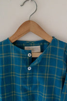 Kids unisex Kurta Pajama set wiith Navy Blue Checks Kurta and White Pajamas perfect for summers. Kurta made with soft breathable handwoven cotton and pajamas made in GOTS certified organic cotton. 