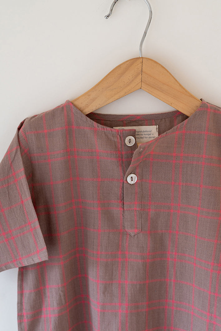 Summer night suit for boys and girls in handwoven cotton in warm sand and pink checks. Perfect co-ord set for summer. Half sleeve kurta in soft handwoven cotton with elasticated shorts. Kurtas and Pajamas,  both have pockets.