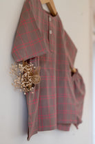 Summer night suit for boys and girls in handwoven cotton in warm sand and pink checks. Perfect co-ord set for summer. Half sleeve kurta in soft handwoven cotton with elasticated shorts. Kurtas and Pajamas,  both have pockets.